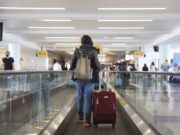 Fully vaccinated people can resume travel at low risk to themselves, new CDC guidance says
