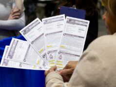 Lawsuit seeks to require Wisconsin clerks to let voters fix problems with their absentee ballots