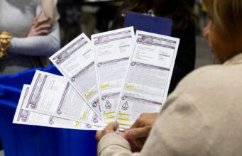 Lawsuit seeks to require Wisconsin clerks to let voters fix problems with their absentee ballots